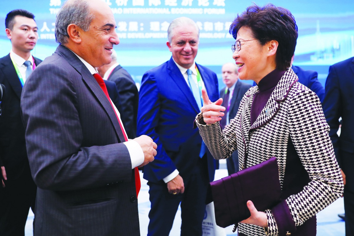 Hong Kong's Chief Executive Carrie Lam talks with a guest at the Second Hongqiao International Economic Forum during the second China International Import Expo (CIIE) in Shanghai, China November 5, 2019. Wu Hong/Pool via Reuters