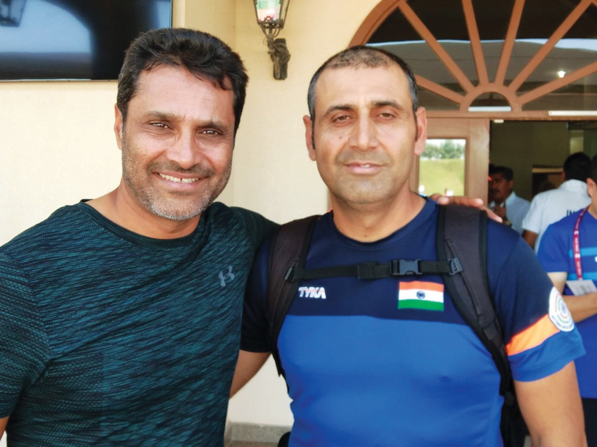 Skeet shooters, Qatar’s Nasser Saleh Al Attiyah and India’s Mairaj Ahmed Khan pose for a picture at the losail Shooting Range yesterday.