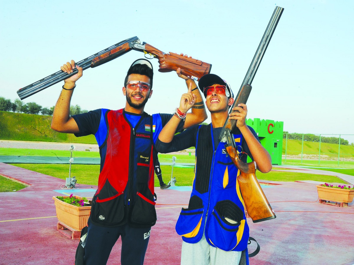 Indian junior trap shooters Vivaan Kapoor (right) and Bhowneesh Mendiratta celebrate after clinching gold and silver medals. Picture: Ebrahim Kutty  
