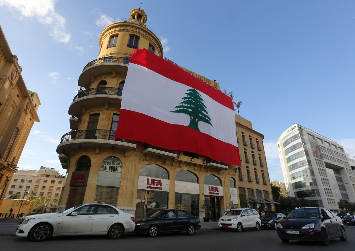 A Lebanese flag hangs from a building in downtown Beirut, November 21, 2017. Reuters / Aziz Taher