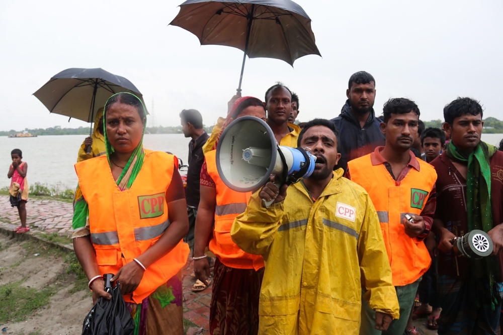 Cyclone Preparedness Programme (CPP) officials urge people to evacuate their homes in preparation for Cyclone Bulbul, in Khulna on November 9, 2019.  AFP