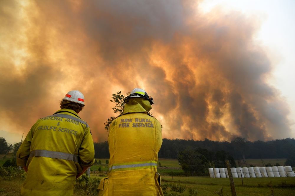 Smoke from a large bushfire is seen outside Nana Glen, near Coffs Harbour, Australia, November 12, 2019. AAP Image/Dan Peled/via REUTERS