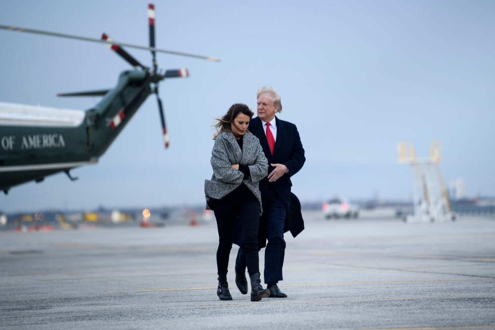 US President Donald Trump and US First Lady Melania Trump walk to Air Force One at John F Kennedy International Airport November 12, 2019, in New York,  AFP / Brendan Smialowski
 