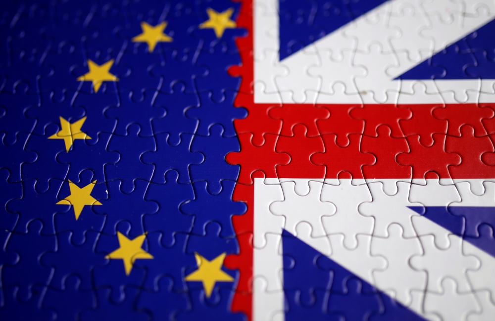 Puzzle with printed EU and UK flags is seen in this illustration taken November 13, 2019. REUTERS/Dado Ruvic/Illustration