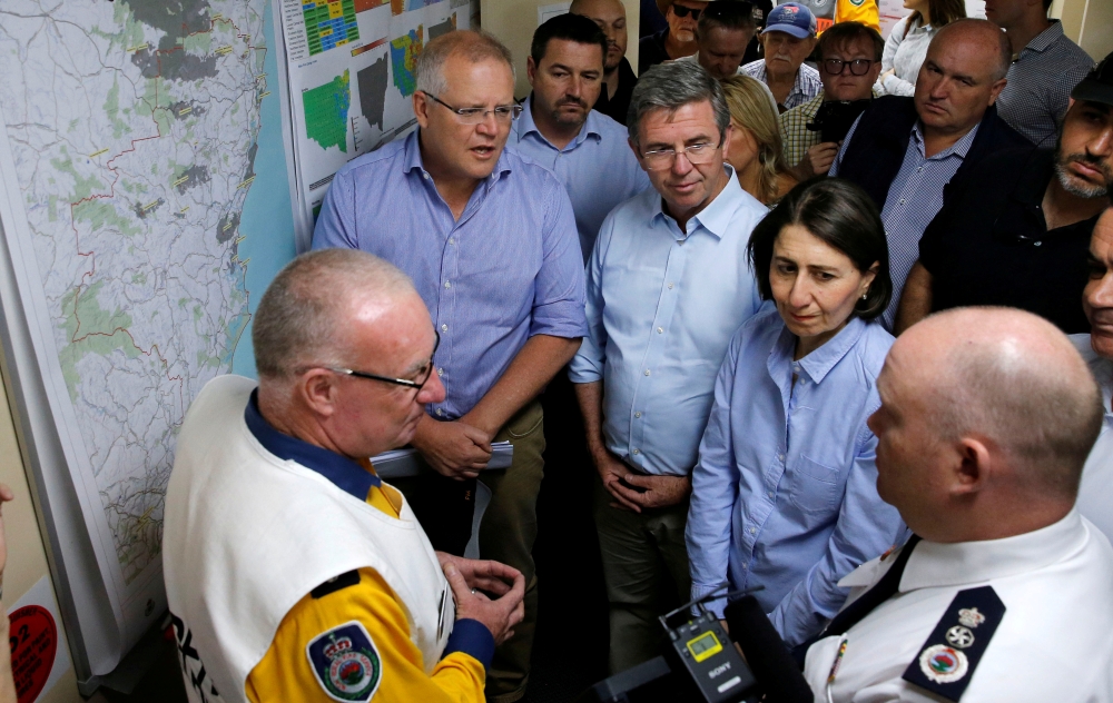 Australia's Prime Minister Scott Morrison and New South Wales Premier Gladys Berejiklian receive a briefing on the fires at Mid North Coast Fire Control Centre in Wauchope, New South Wales, Australia, November 10, 2019. AAP Image/Darren Pateman/via Reuter