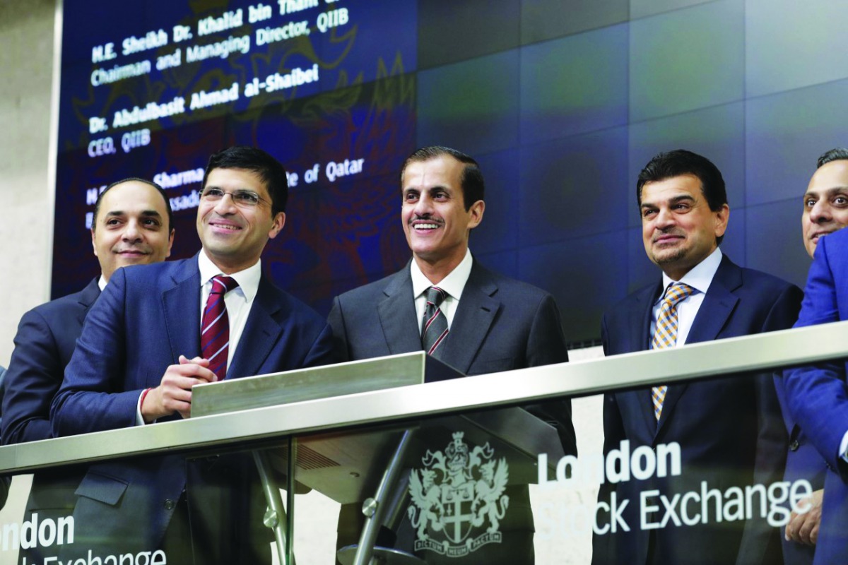 Sheikh Dr. Khalid bin Thani Abdullah Al Thani (third left), QIIB Chairman and Managing Director; Dr. Abdulbasit Ahmad Al Shaibei (fourth left), QIIB CEO; and other officials during QIIB’s Sukuk listing on London Stock Exchange.