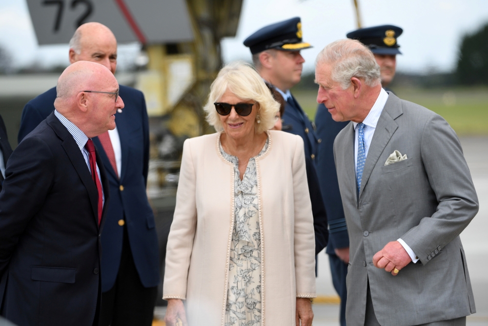 Britain's Prince Charles and his wife Camilla, Duchess of Cornwall, are greeted as they arrive at RNZAF Whenuapai in Auckland, New Zealand, November 17, 2019. REUTERS/Tracey Nearmy