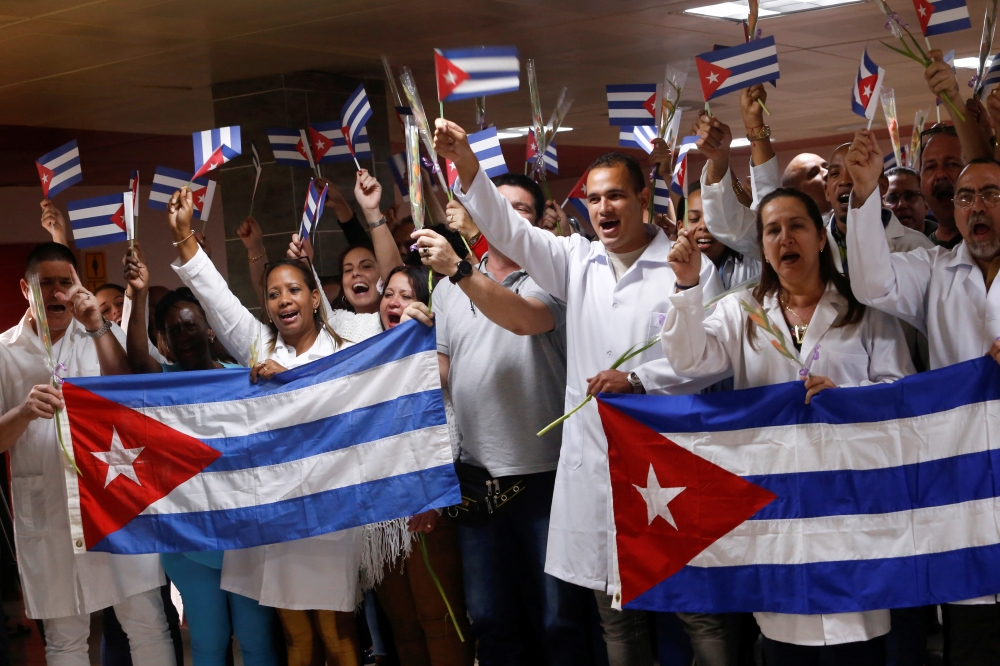 Cuban doctors coming back from Bolivia take part in a a welcome ceremony at Jose Marti International Airport in Havana, Cuba, November 16, 2019. Reuters