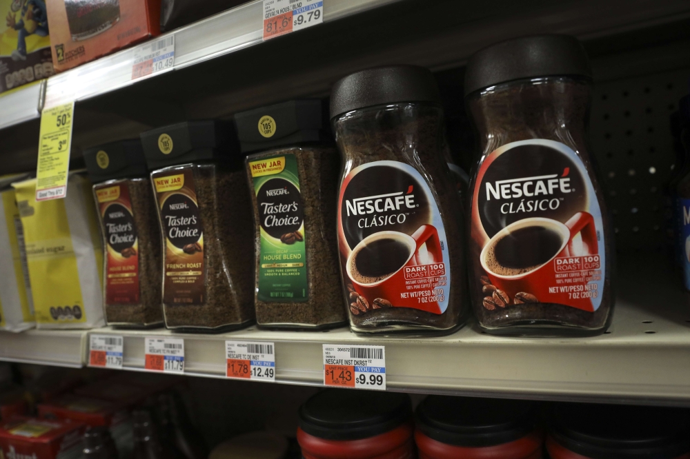 Nescafe coffee products of Nestle sit on the shelf at a CVS Pharmacy store, May 7, 2018, in New York City. Drew Angerer / Getty Images / AFP