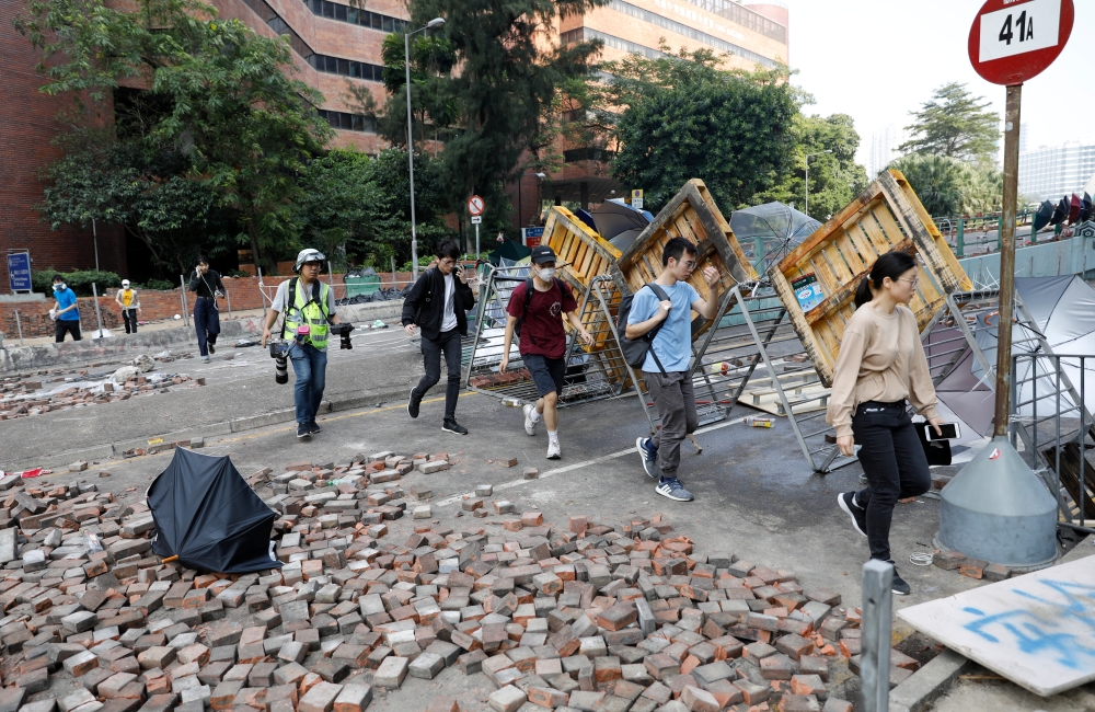 Protesters attempt to leave the campus of Hong Kong Polytechnic University (PolyU) in Hong Kong, China November 18, 2019. REUTERS/Adnan Abidi