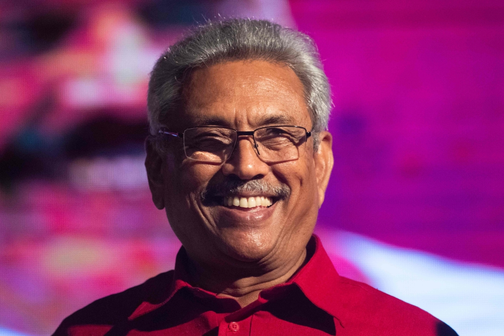 In this file photo taken on November 13, 2019 Sri Lanka Podujana Peramuna (SLPP) party presidential candidate Gotabaya Rajapaksa smiles during a campaign rally in Homagama ahead of the November 16 presidential election.  AFP / Jewel SAMAD 