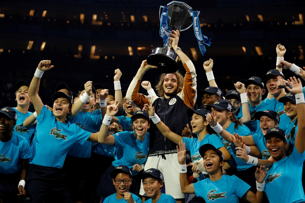 Stefanos Tsitsipas celebrates winning the ATP Finals with the trophy REUTERS/Peter Nicholls
