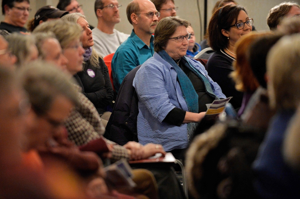 Members of SEA/SEIU Local 1984, government employees, listen as Democratic presidential hopeful Massachusetts' Senator Elizabeth Warren speaks at the Holiday Inn in Concord New Hampshire, after signing papers to officially enter the New Hampshire Primary 
