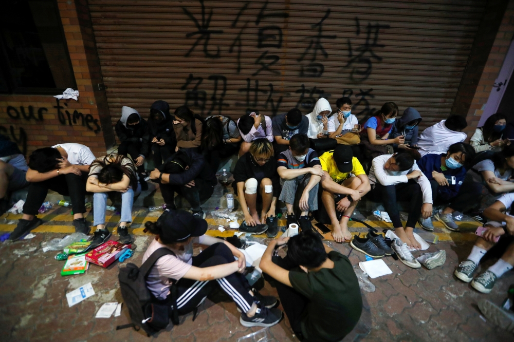 Protesters wait to receive medical attention at the Hong Kong Polytechnic University campus during protests in Hong Kong, China, November 19, 2019. REUTERS/Adnan Abidi
 