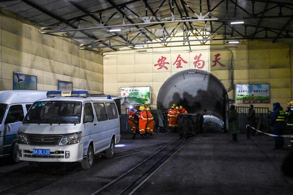 Rescuers work at the site of a coal mine explosion in Pingyao, in China's northern Shanxi province early on November 19, 2019. A coal mine explosion killed 15 people in north China's Shanxi province, state media reported on November 19. - China OUT / AFP 