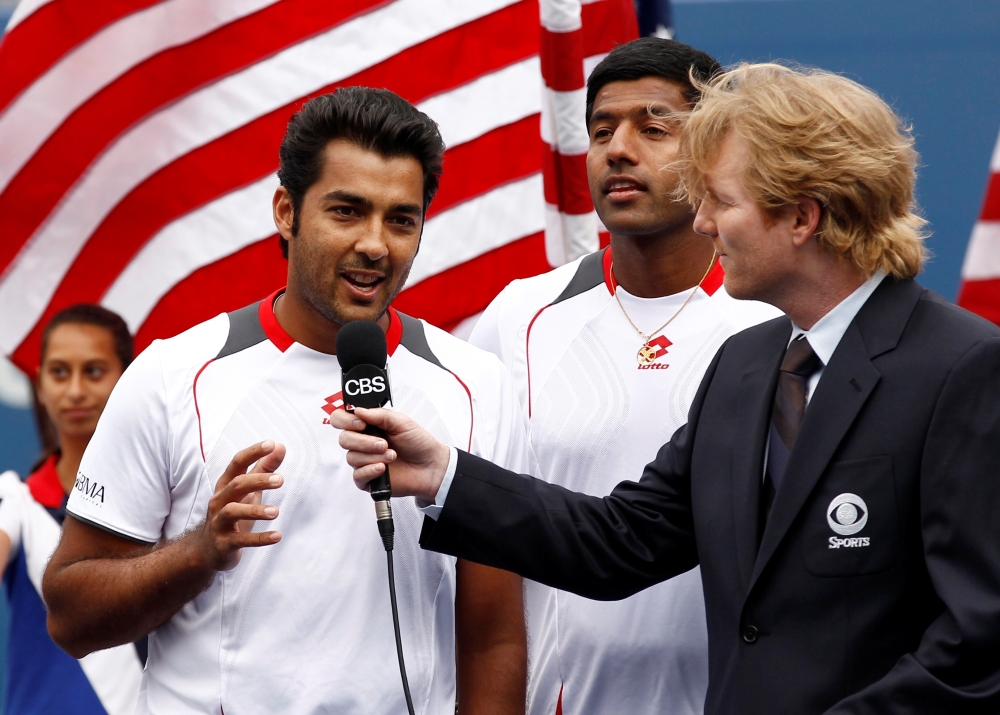 FILE PHOTO: Aisam-Ul-Haq Qureshi (L) of Pakistan and Rohan Bopanna of India are interviewed after their doubles match against Bob and Mike Bryan of the U.S. at the U.S. Open tennis tournament in New York, September 10, 2010. REUTERS/Kevin Lamarque/File Ph
