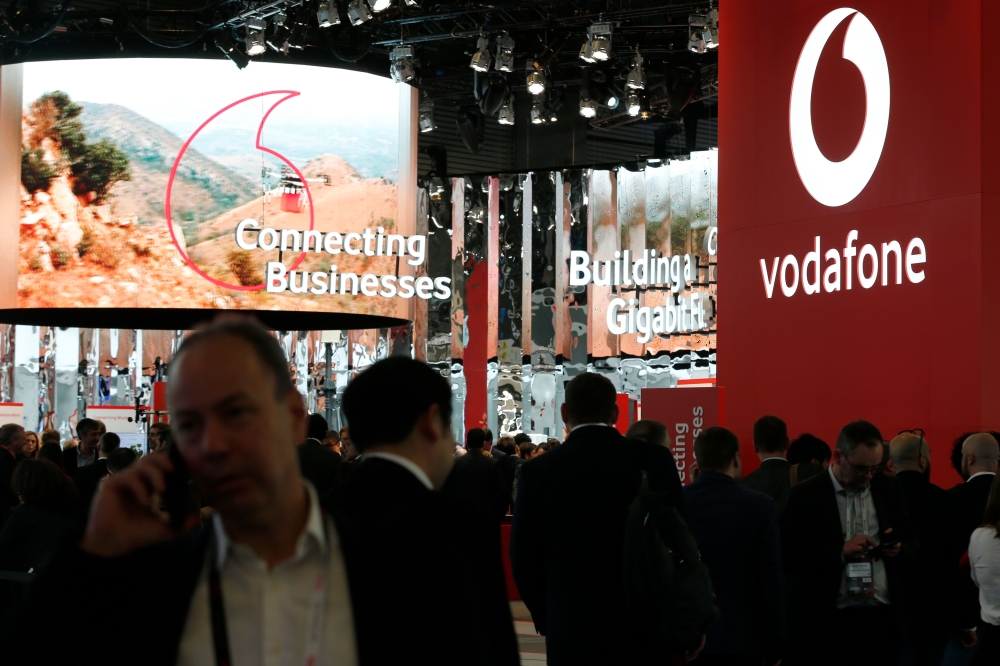 People visit the Vodafone stand at the Mobile World Congress in Barcelona on February 25, 2019. AFP / Pau Barrena