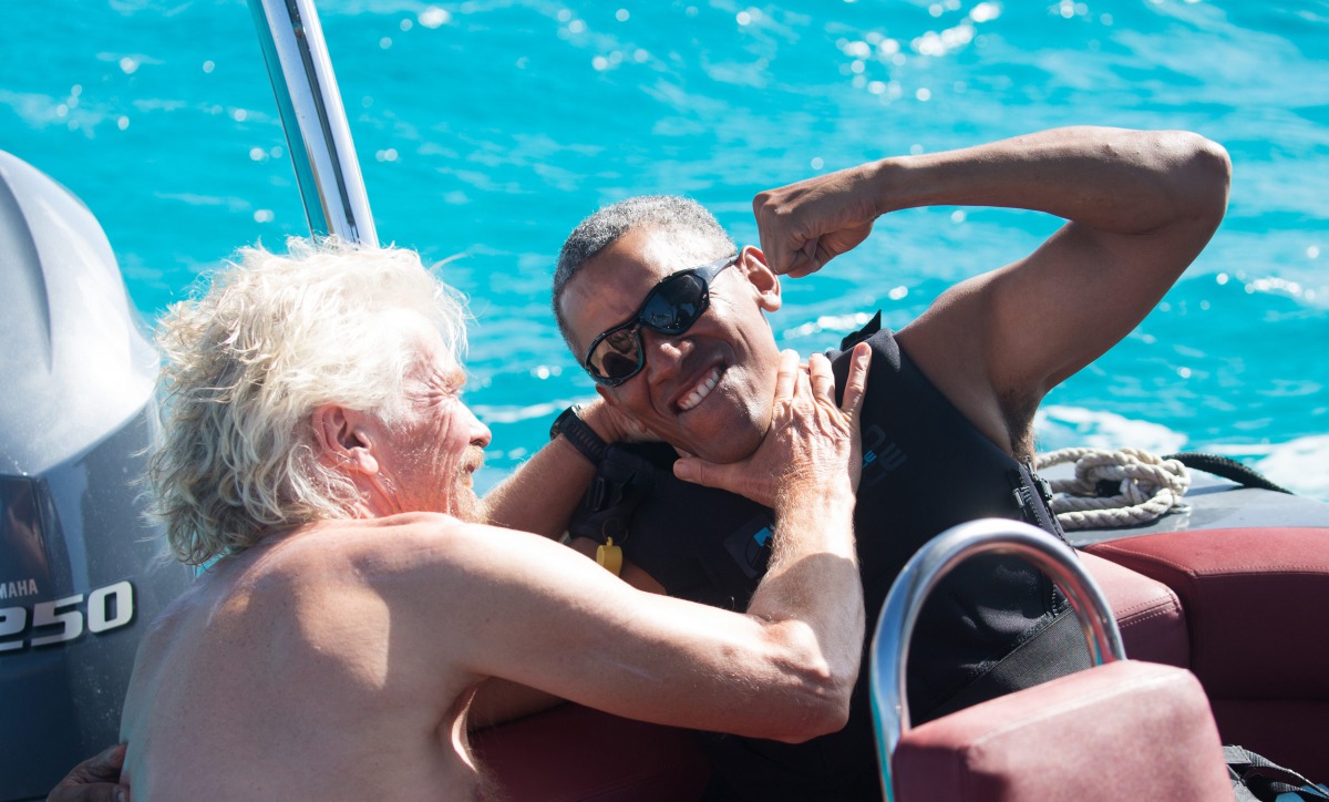 Barack Obama and Richard Branson sit on a boat on Moskito island the British Virgin Islands in a picture handed out by Virgin on February 7, 2017 via Reuters