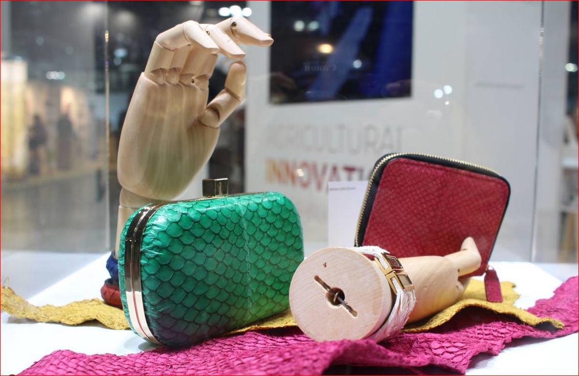 Luxury handbags made with fish skin leather by Brazilian designer Barbara della Rovere, seen at the Seeds & Chips food summit in Milan, Italy, on May 6, 2019. Thomson Reuters Foundation/Thin Lei Win.