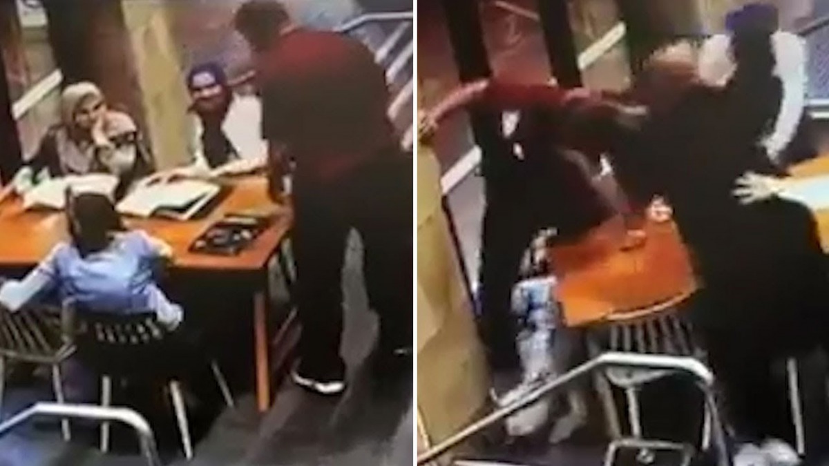 Shocking security camera footage showed a man approaching a table of three women wearing headscarves as they chatted at a cafe in the city's west on Wednesday.