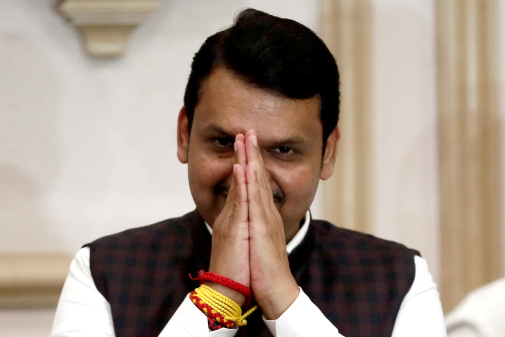 Bharatiya Janata Party (BJP) leader Devendra Fadnavis greets the media during a press conference after announcing his resignation as Maharashtra chief minister in Mumbai, India, November 26, 2019. Reuters/Francis Mascarenhas
 