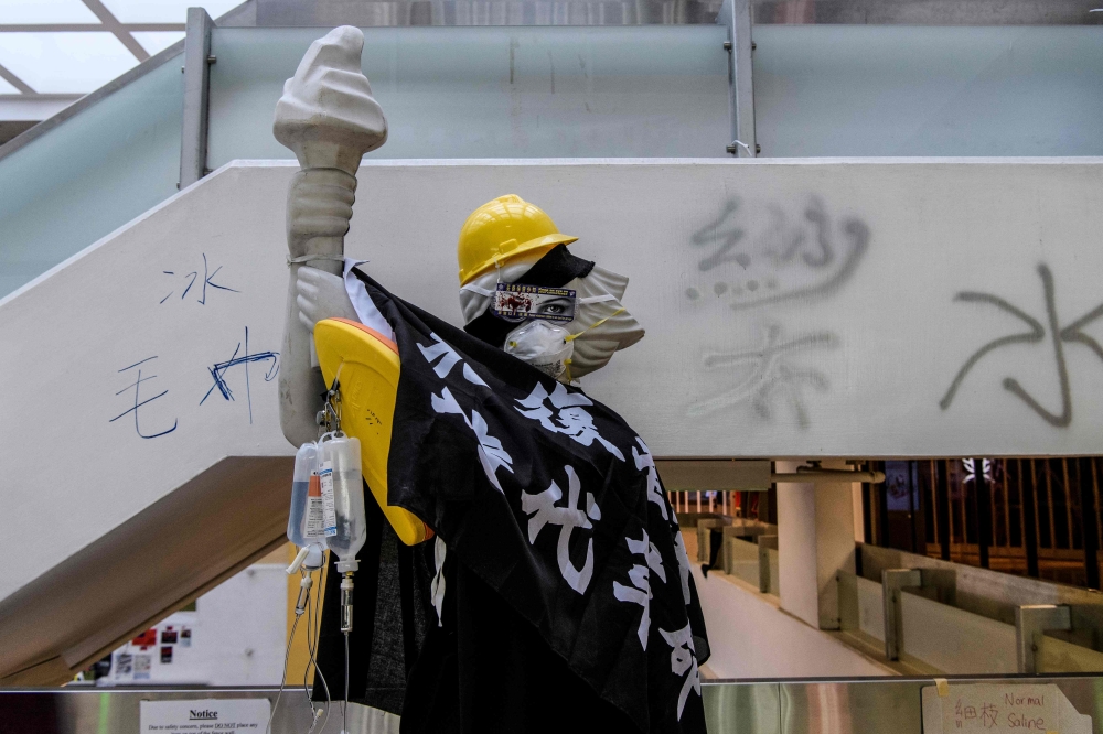 A 'Statue of Democracy' is seen in a hallway of the Hong Kong Polytechnic University in the Hung Hom district of Hong Kong on November 26, 2019, over a week after police surrounded the building while protesters were still barricaded inside. AFP / Anthony 
