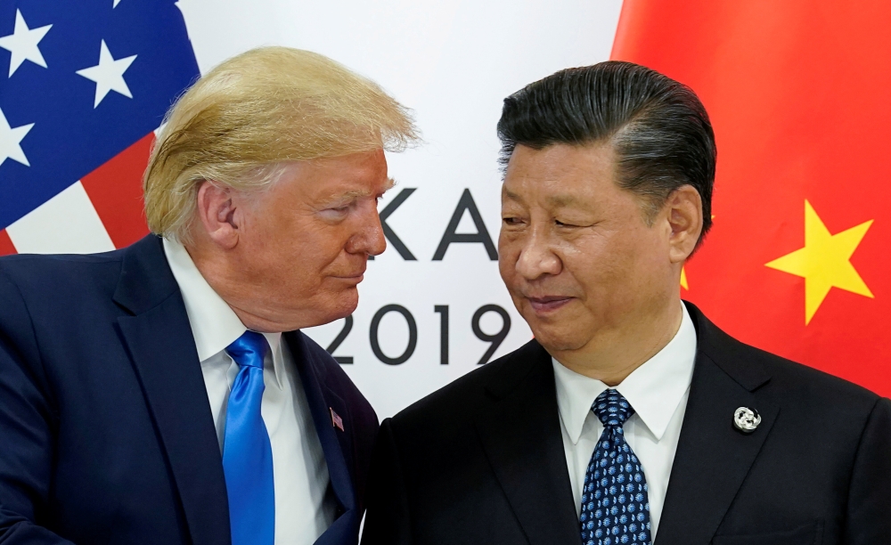 FILE PHOTO: U.S. President Donald Trump meets with China's President Xi Jinping at the start of their bilateral meeting at the G20 leaders summit in Osaka, Japan, June 29, 2019. Reuters/Kevin Lamarque 