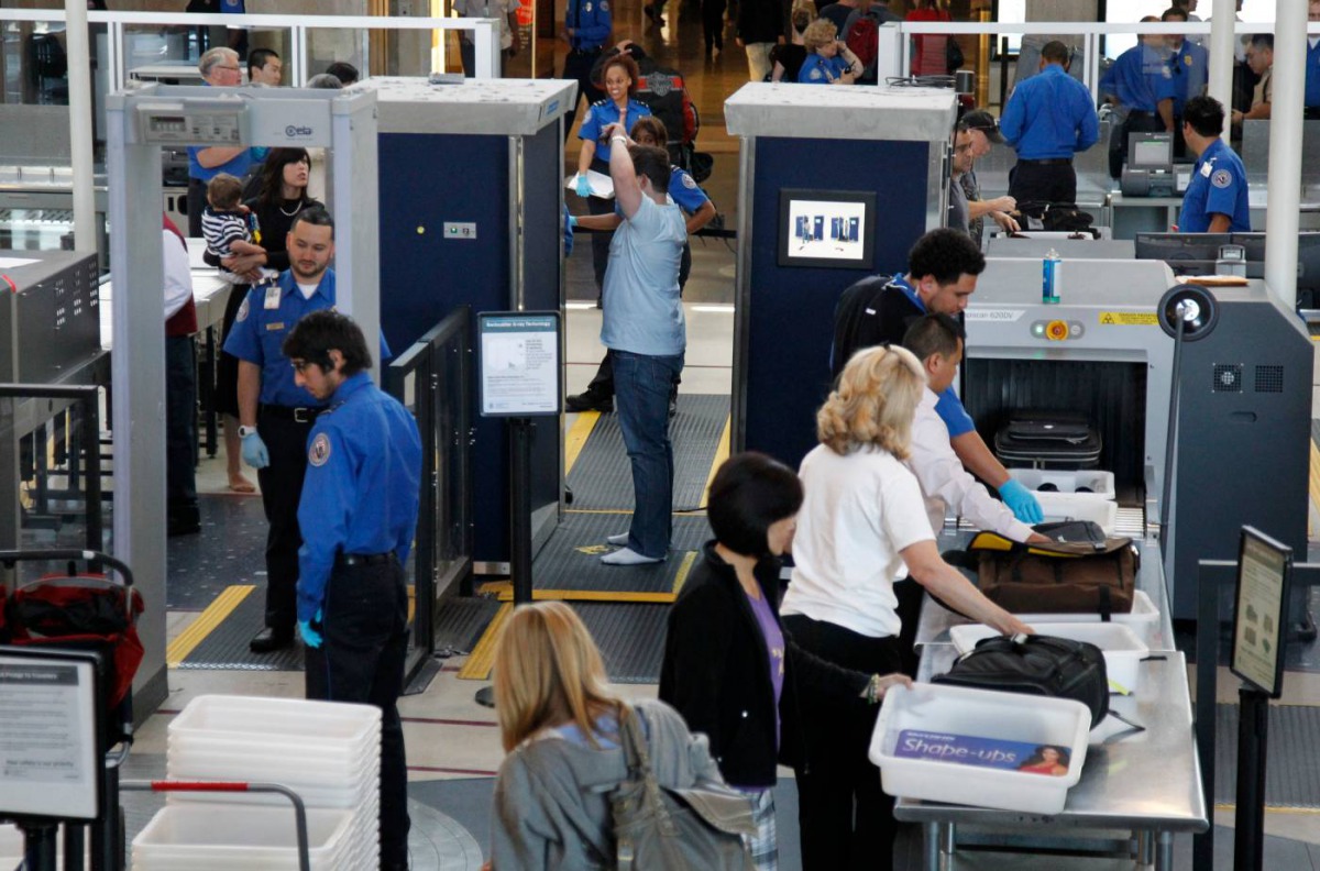A man is screened with a backscatter x-ray machine as travellers go through a TSA security checkpoint in terminal 4 at LAX, Los Angeles International Airport, May 2, 2011. Reuters/Danny Moloshok