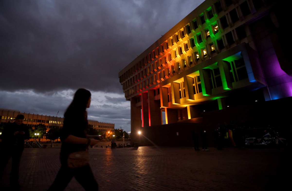 Boston's City Hall is lit in the colors of the pride flag for the victims of the mass shooting at Orlando's Pulse nightclub, in Boston, Massachusetts, U.S. June 13, 2016. Reuters/Gretchen Ertl 