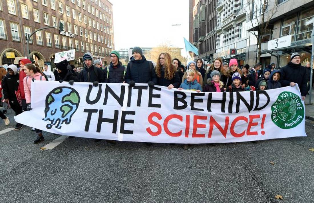 Protesters hold a banner during the Global Climate Strike of the youth climate movement Fridays for Future, in Hamburg, Germany, November 29, 2019. Reuters/Fabian Bimmer