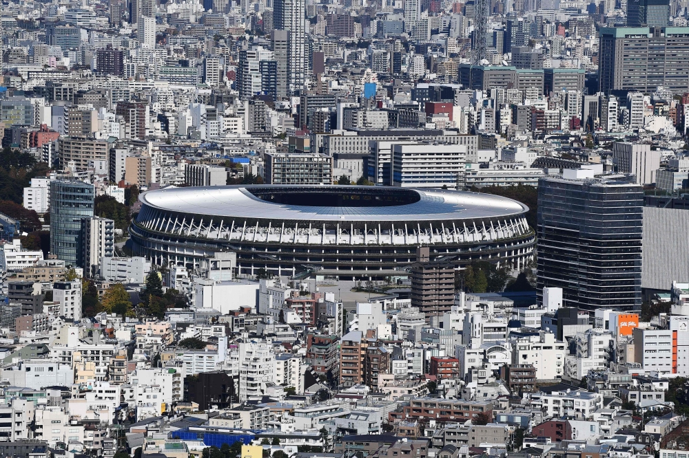 The new 1.4 billion USD main venue for the 2020 Tokyo Olympic Games is pictured after being officially completed in Tokyo on November 30, 2019. The five-story stadium, designed by renowned Japanese architect Kengo Kuma, will seat 60,000 fans and nods to t