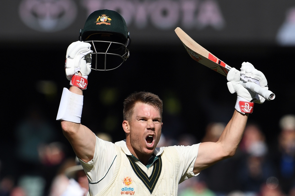Australia's batsman David Warner celebrates reaching his triple century (300 runs) during the day two of the second cricket Test match between Australia and Pakistan in Adelaide on November 30, 2019. -- I/ AFP / William WEST /