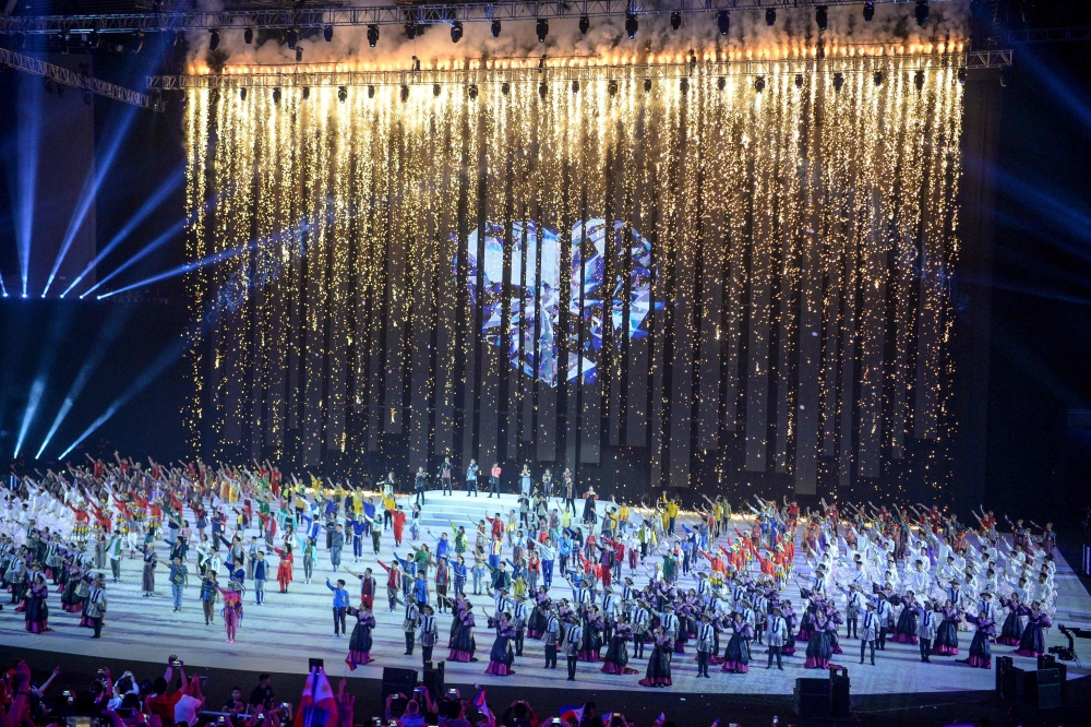 Performers take part as a digital fireworks fountain is shown during the opening ceremony of the SEA Games (Southeast Asian Games) at the Philippine Arena in Bocaue, Bulacan province, north of Manila on November 30, 2019. / AFP / Ted ALJIBE