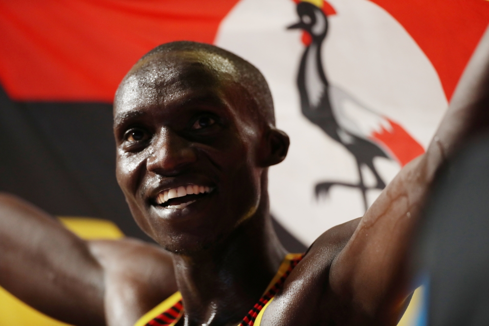 FILE PHOTO: Uganda's Joshua Cheptegei celebrates winning gold at the IAAF Championships in Doha 2019. Reuters/Aleksandra Szmigiel/File Photo