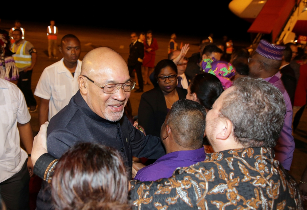 Suriname's President Desi Bouterse, who was convicted of murder for the execution of opponents by a court in Suriname, greets friends and government officials after arriving from China, in Paramaribo, Suriname December 1, 2019. Reuters/Ranu Abhelakh
 