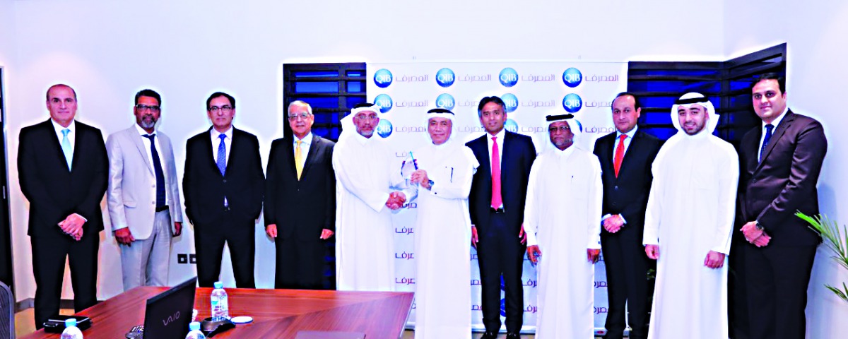 The officials posing for a group picture after receiving the award.