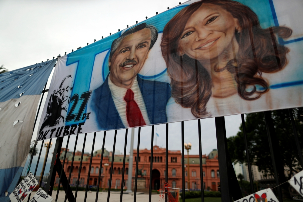 A placard depicting Alberto Fernandez and Cristina Fernandez de Kirchner, is seen outside the Presidential Palace Casa Rosada at in Buenos Aires, Argentina November 29, 2019. Reuters/Agustin Marcarian
 