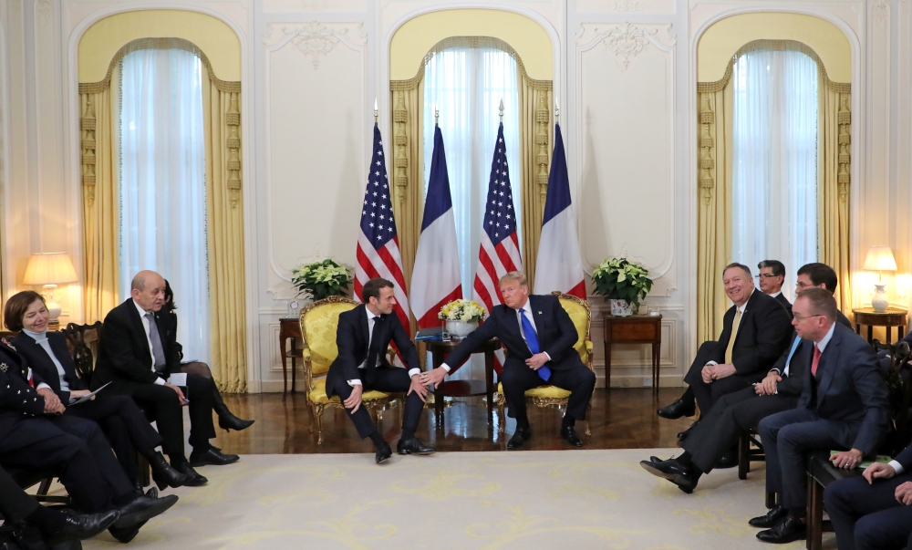 U.S. President Donald Trump and France's President Emmanuel Macron meet, ahead of the NATO summit in Watford, in London, Britain, December 3, 2019. Ludovic Marin/Pool via REUTERS
