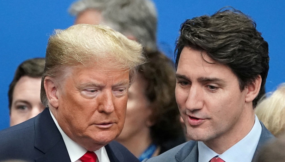 Donald Trump talks with Justin Trudeau during a North Atlantic Treaty Organization Plenary Session at the NATO summit in Watford, Britain, December 4, 2019. Reuters/Kevin Lamarque