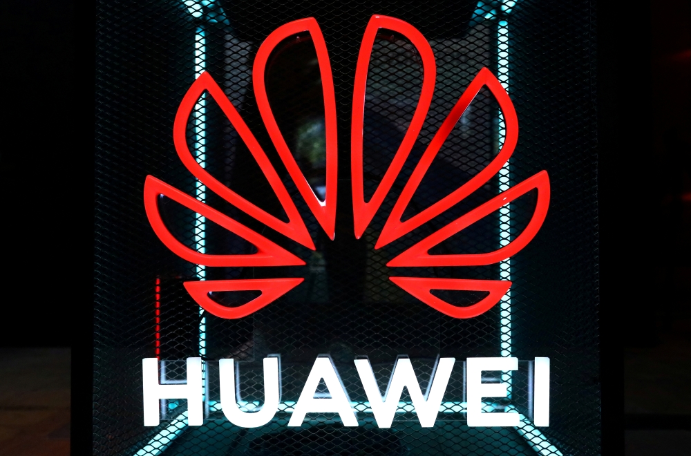 The Huawei logo is pictured at the IFA consumer tech fair in Berlin, Germany, September 5, 2019. REUTERS/Hannibal Hanschke/File Photo