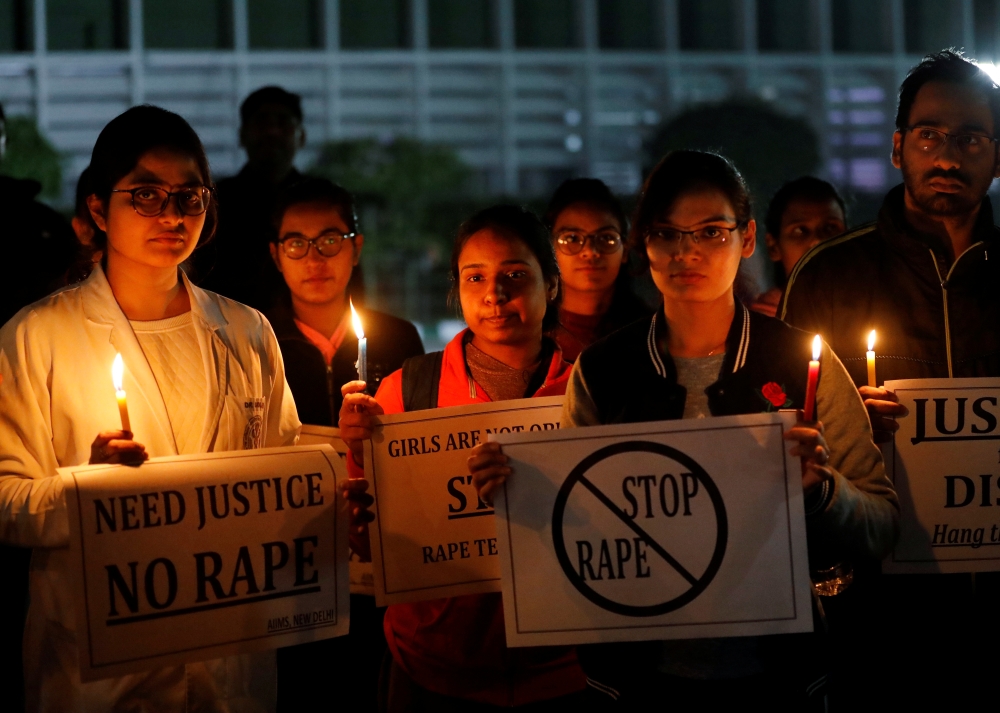 Resident doctors and medical students from All India Institute Of Medical Sciences (AIIMS) attend a candle-lit march to protest against the alleged rape and murder of a 27-year-old woman on the outskirts of Hyderabad, in New Delhi, India, December 3, 2019