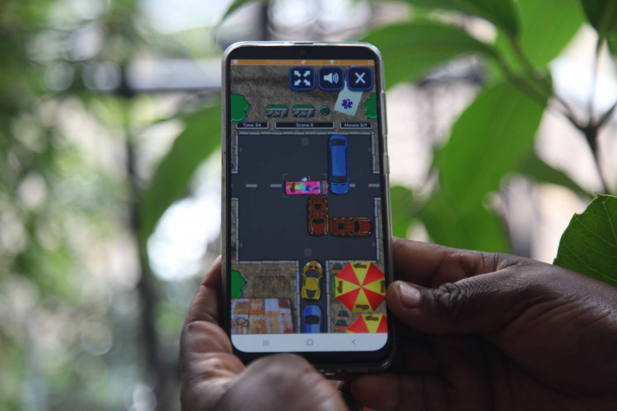 A mobile phone user plays Jam Nomo, a new game by Kenya-based firm Usiku Games, in Nairobi, Kenya on Dec 5, 2019. Thomson Reuters Foundation/Nita Bhalla