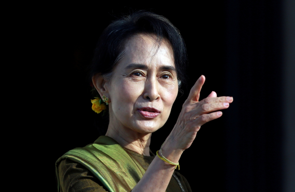 FILE PHOTO: Myanmar pro-democracy leader Aung San Suu Kyi arrives at Parliament buildings on the Stormont estate in Belfast, Northern Ireland October 24, 2013. REUTERS/Cathal McNaughton