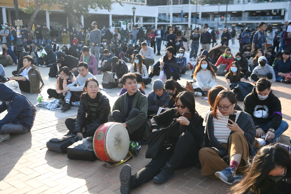 People attend a rally to support Yuli Riswati, an Indonesian domestic worker and journalist who was deported, in the district of Central in Hong Kong, China December 7, 2019. REUTERS/Laurel Chor