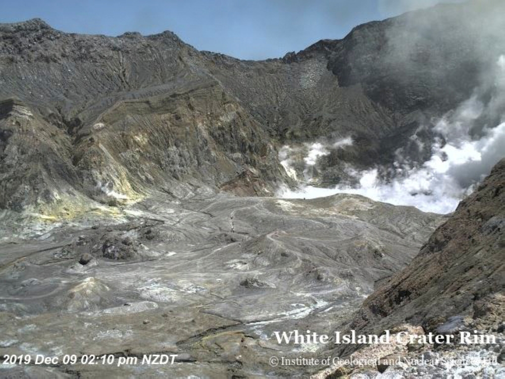 An aeriel view shows hikers walking on the crater rim of Whakaari, also known as White Island, shortly before the volcano erupted in New Zealand, December 9, 2019, in this image obtained via social media. GNS Science via REUTERS 