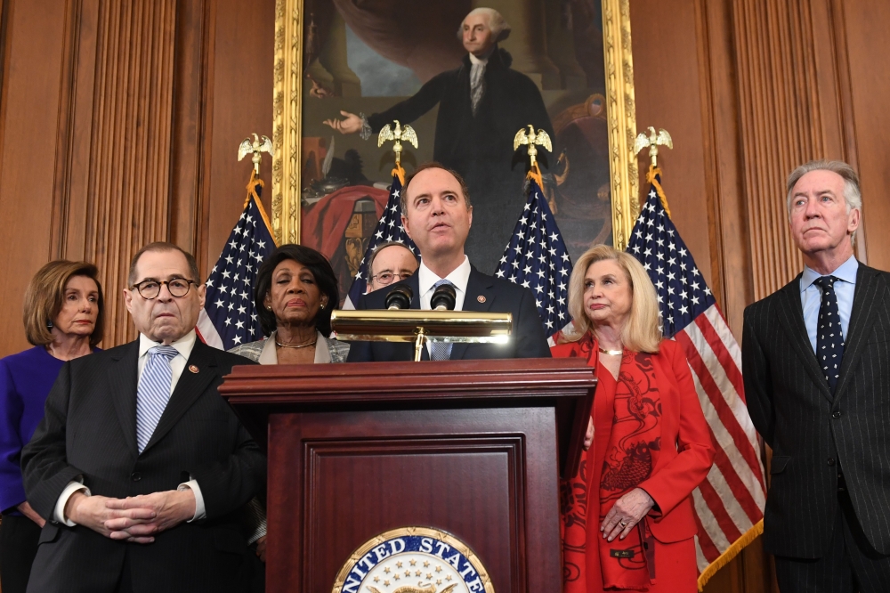 Adam Schiff, Jerry Nadler(2ndL), Nancy Pelosi(L), Eliot Engel(R), Maxine Waters(3rdL), Democrat of California, and Carolyn Maloney(2ndR) announces articles of impeachment for US President Donald Trump during a press conference, December 10, 2019. AFP / Sa