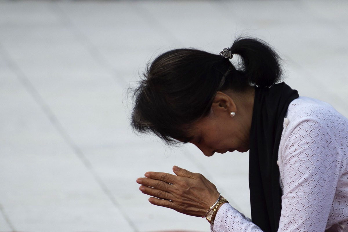 This file photo taken on July 19 2016 shows Myanmar State Counsellor Aung San Suu Kyi paying her respects to her late father Myanmar independence hero General Aung San during a ceremony in Yangon. AFP / Ye Aung