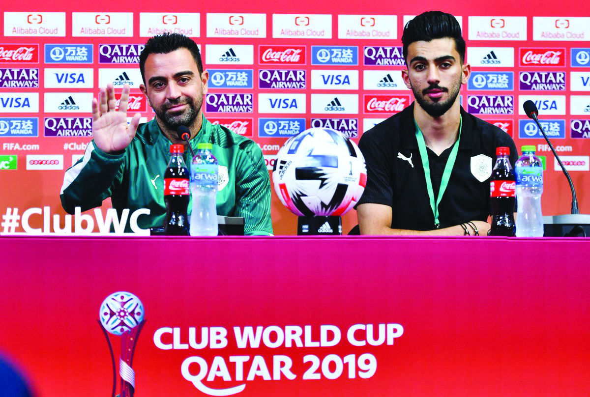 Al Sadd’s coach Xavi Hernandez (left) and midfielder Tarek Salman during a pre-match press conference held in Doha yesterday, on the eve of their FIFA Club World Cup 2019 match against Hienghene Sport.
