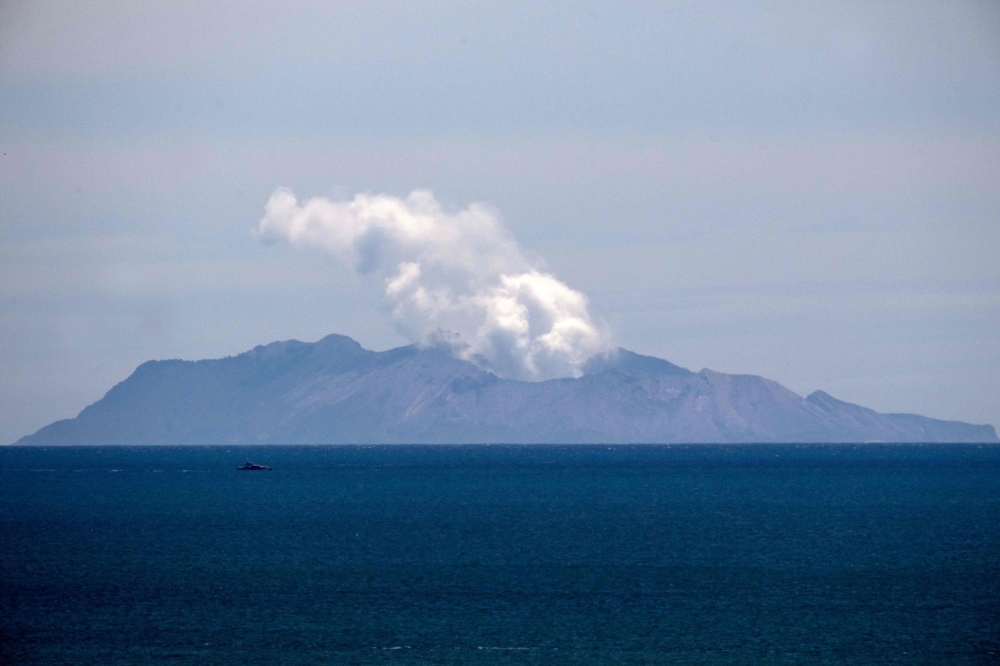 Steam rises from the White Island volcano following the December 9 volcanic eruption, in Whakatane on December 11, 2019. AFP / Marty Melville 