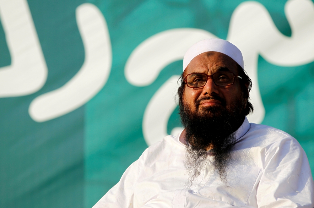 FILE PHOTO: Hafiz Muhammad Saeed, chief of the banned Islamic charity Jamat-ud-Dawa, looks over the crowed as they end a 